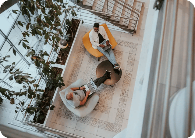 Two Mews workers having a chat while seating in a sofa 